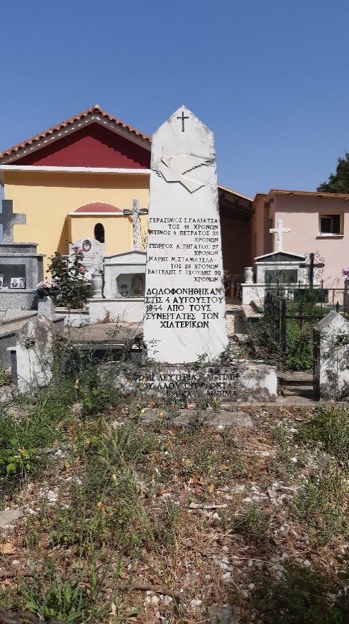 Marble stele in a cemetery. It bears a text, an engraved cross and an embossed dove carrying an olive branch